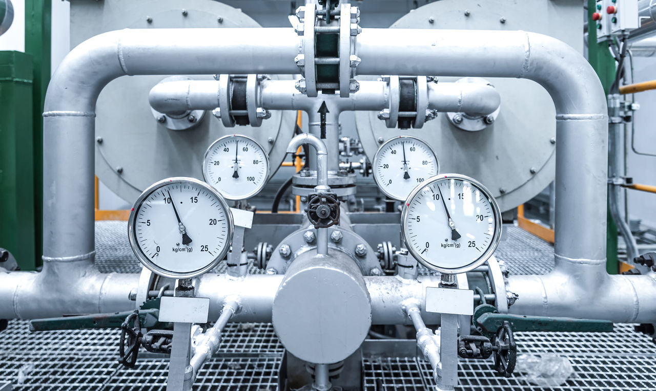 Pressure gauge and pipe at Industrial zone, Steel pipelines and equipment, pipelines and insulation ,Factory and power plant concept.