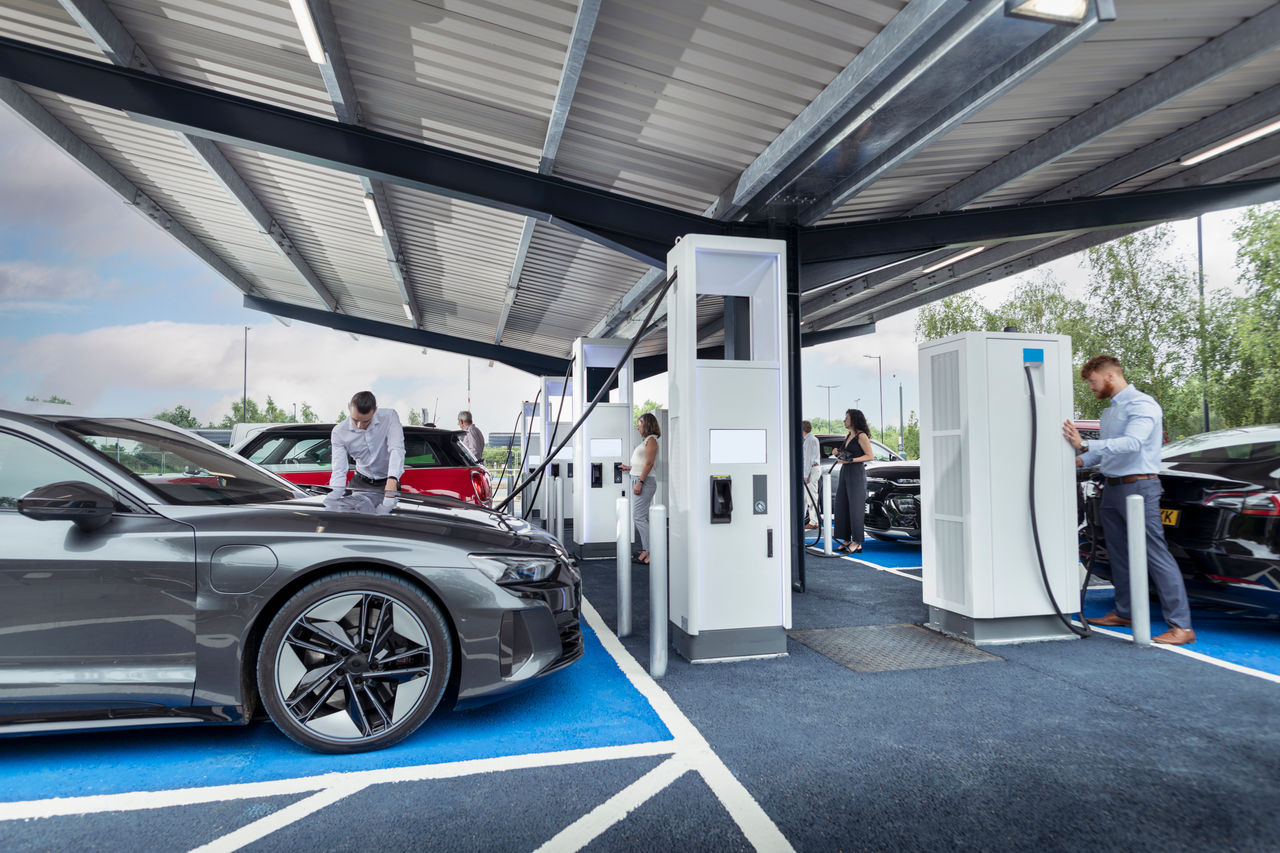 Vehicles parked at an EV charging station.